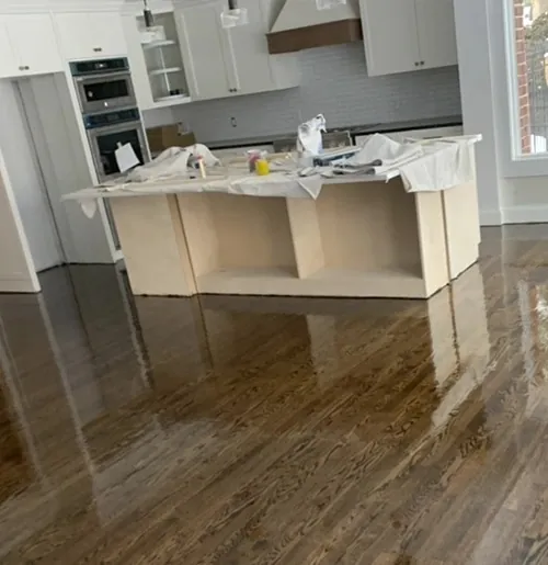 Dark glossy hardwood around a kitchen island