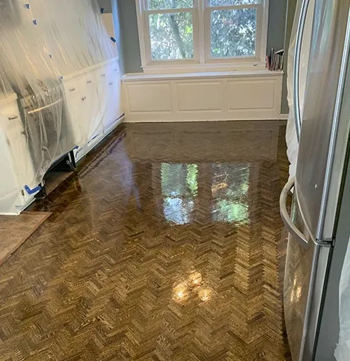 Herringbone hardwood in a kitchen with a fresh finish